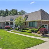 Charming Brick Pond Front Home with Screened Porch, Cottage Interiors & Lush Gardens