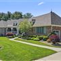 Charming Brick Pond Front Home with Screened Porch, Cottage Interiors & Lush Gardens